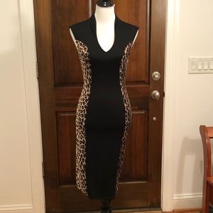 Form-flattering black and leopard print dress.